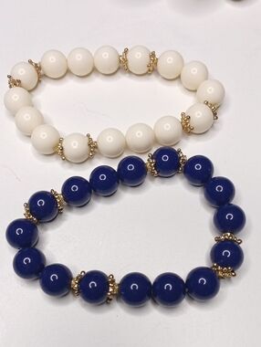 mark. Pair Up Bracelets. Gold Finish With Navy & Ivory Beads